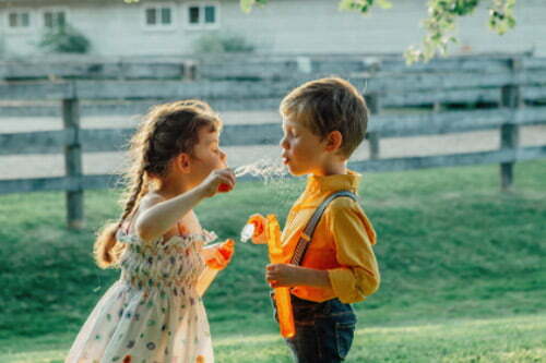 Children playing bubbles